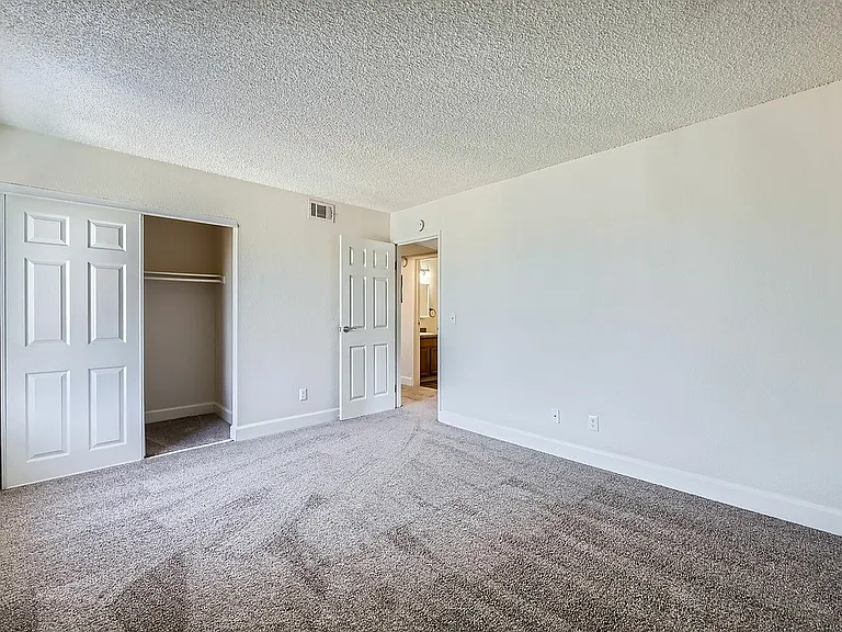 Experience the comfort of a spacious bedroom with ample natural light.