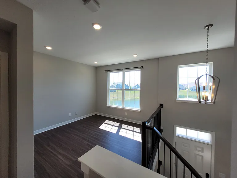 Dining room flooded with light overlooking the pond