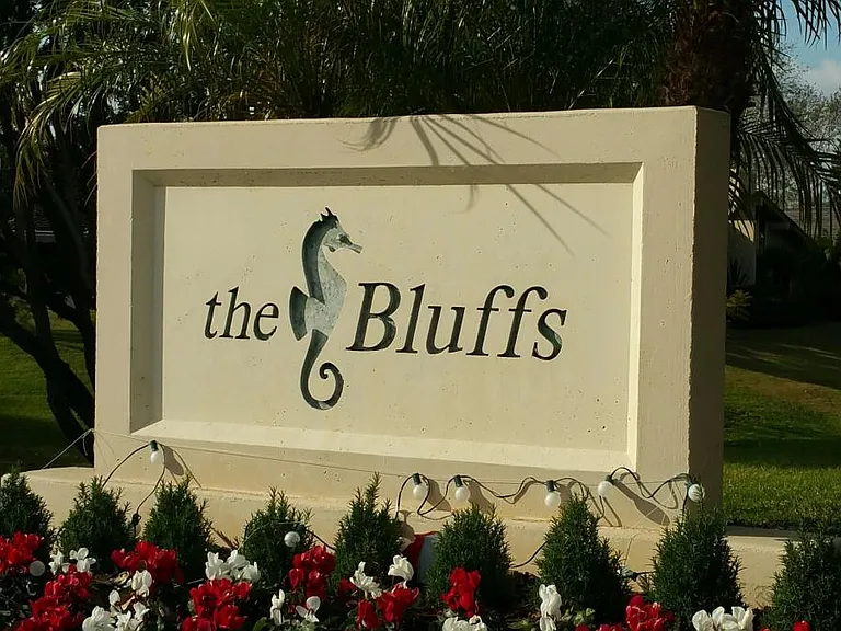he Bluffs is a planned community located on 150 gently rolli