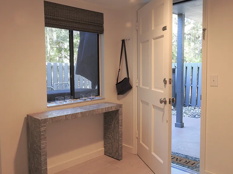 Serenity and style awaits as you step inside the foyer. New porcelain tile floors throughout the downstairs level.