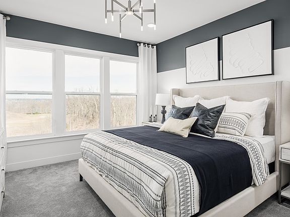 Owner s Suite with a Walk-in Closet and Private Bathroom