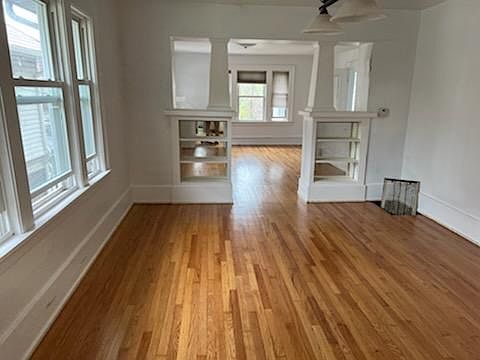 Dining Room looking into Living Room, newly refinished hardwood floor