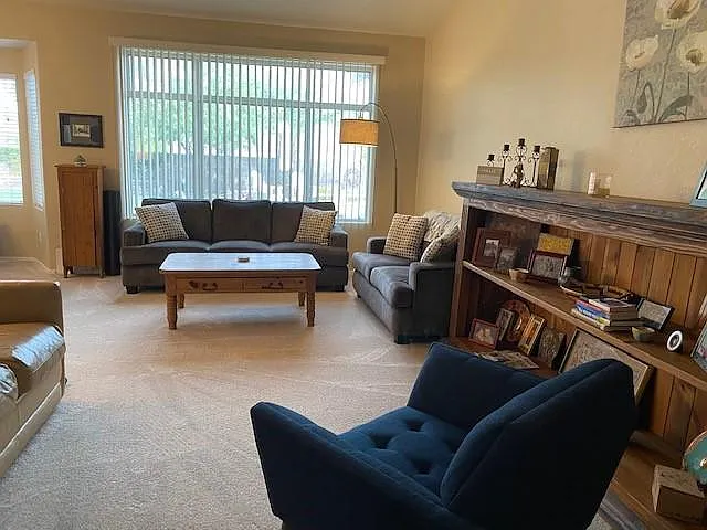 Living room with a window looking to the backyard.