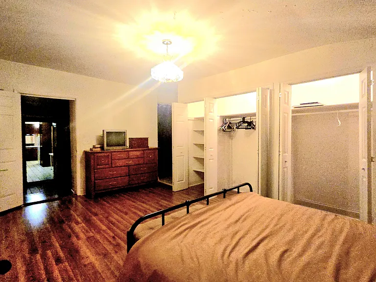 Looking out the bed room thru the bath, hall, kItchen and front room to the floor door. The apartment is a BIG one bedroom.