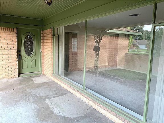 Leaded glass front door. Large porch.