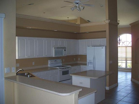 Kitchen and dining room in background