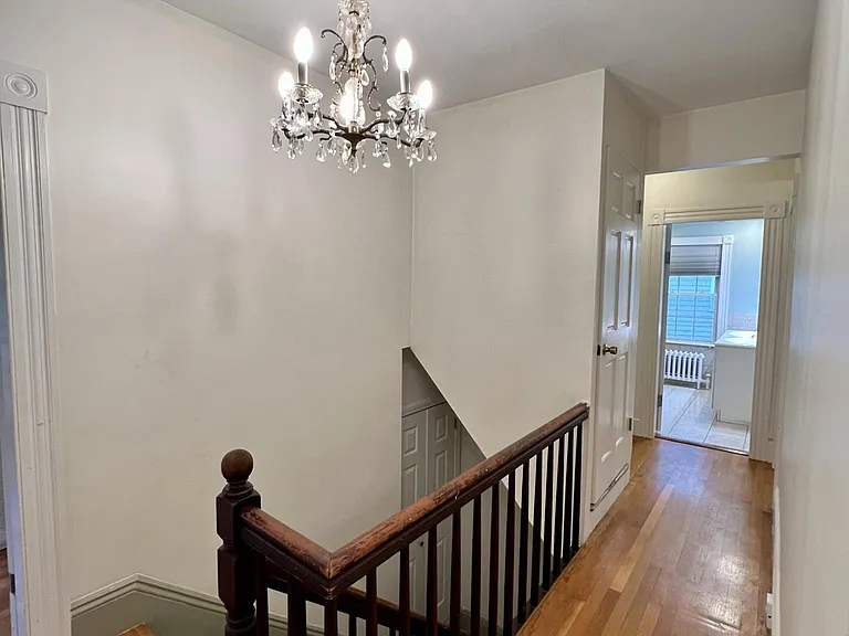Hallway to second private entrance and coat closet