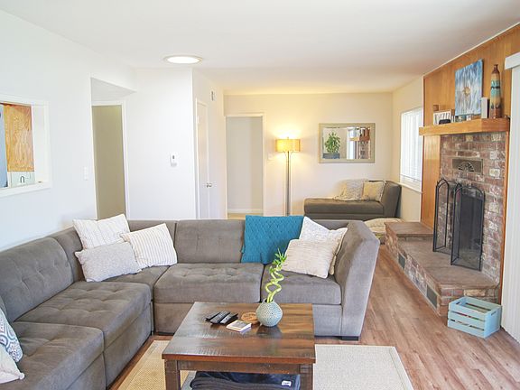 Living room with Fireplace and Den
