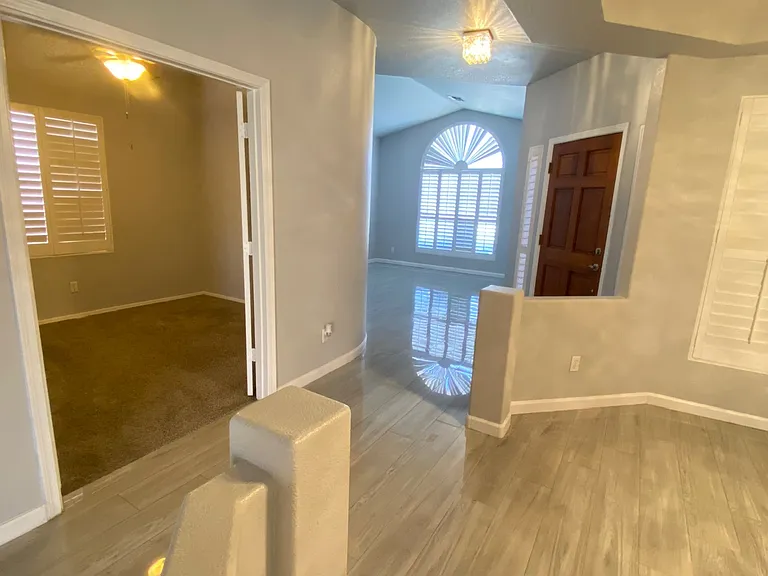 Entry With Living Room, Formal Dining Room and Double Doors to 4th Bedroom
