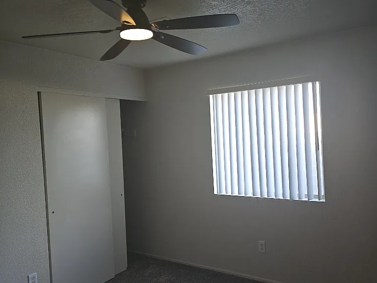 Right bedroom, new ceiling fan and new blinds.