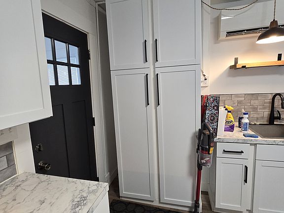 Double pantry in kitchen for added storage.