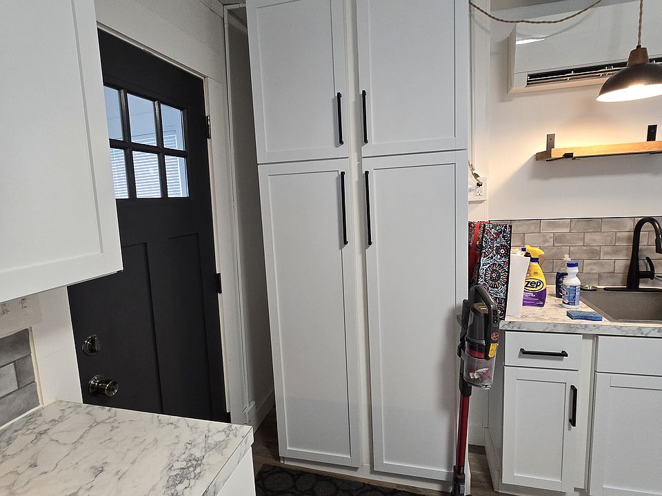 Double pantry in kitchen for added storage.