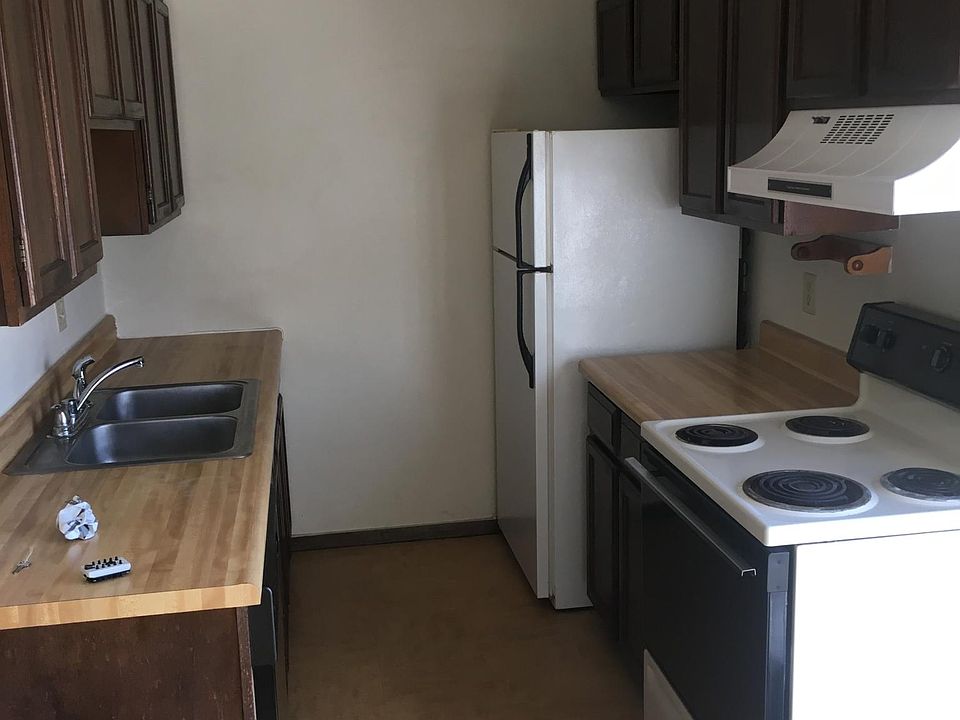 Kitchen includes refrigerator, stove, and dishwasher.