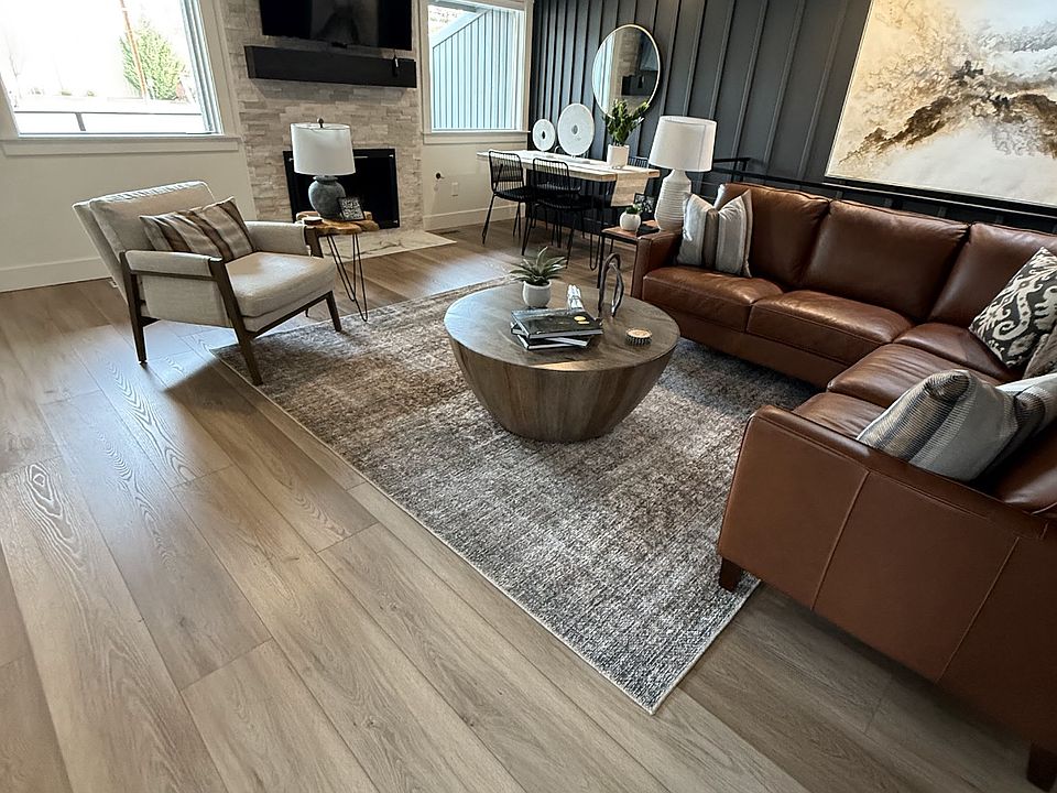 Living room with sectional sofa, occasional chair, and fireplace