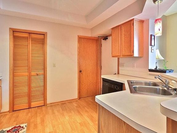 Furnace room, half bath and door to garage