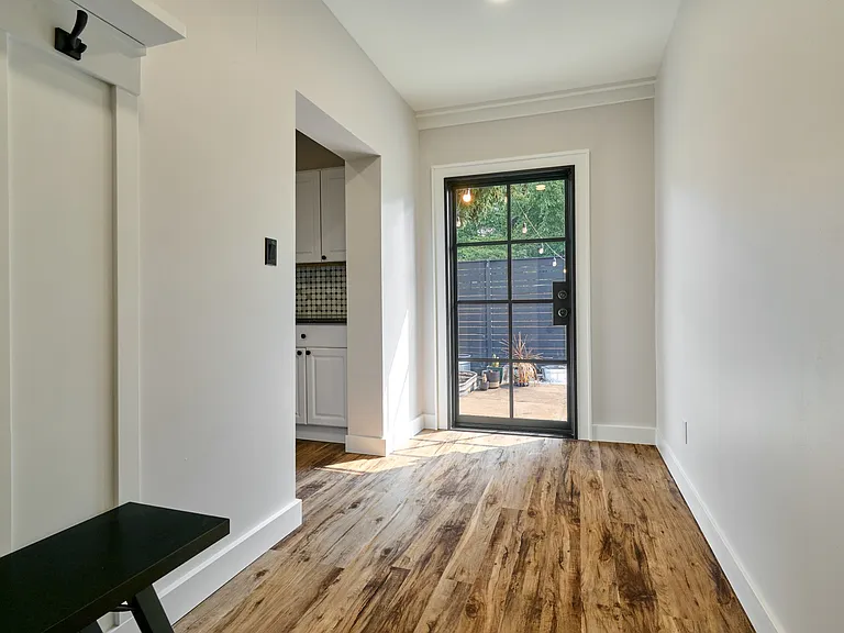 Mudroom (New Addition) showing Door to Backyard