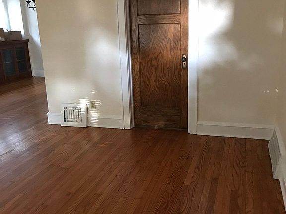 Living room with door leading to bedroom.