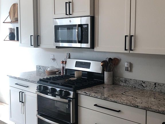 Kitchen view. Double oven with gas range.