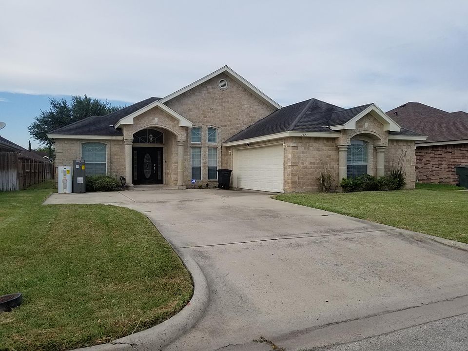 Front view of the house with driveway