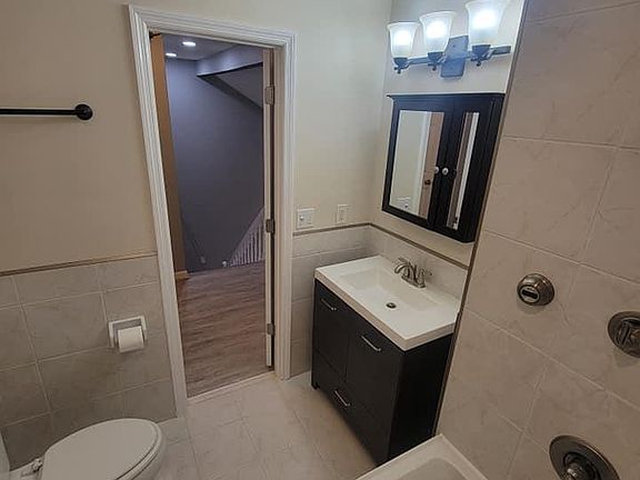 Upstairs bathroom - tub with jets and brand new vanity