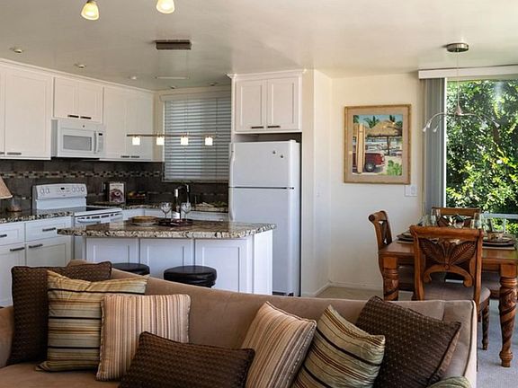 Open space living room, dinner area, and kitchen.