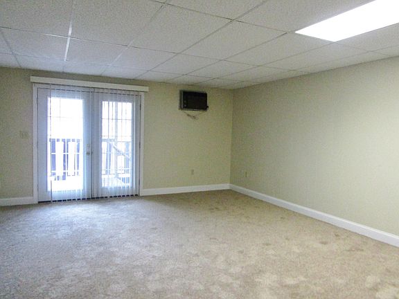 Large living room/bedroom with slider to shared deck & in-wall A/C