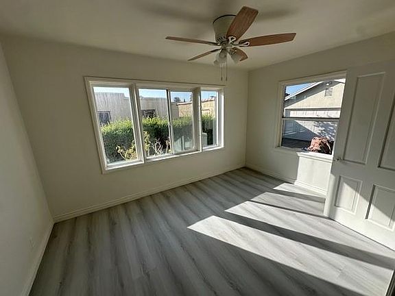 Formal Dining room, with fan and newly renovated floors.