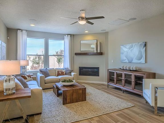 A cozy fireplace in the gathering room provides warmth and ambiance on those cool New Mexico evening