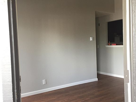 Living room includes vaulted ceiling