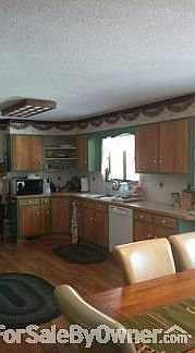 Back of home with deck