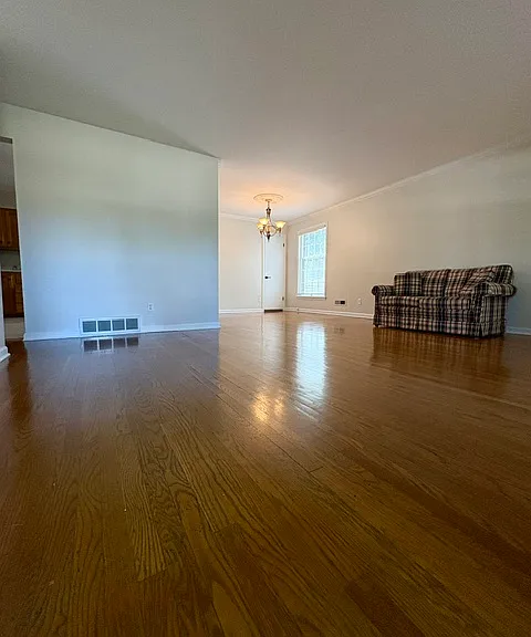 Front entrance with plenty of room for a living and dining area.