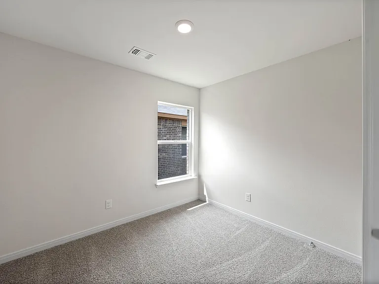 The flex room sits off of the family room and is a great space for an at-home office or guest room.