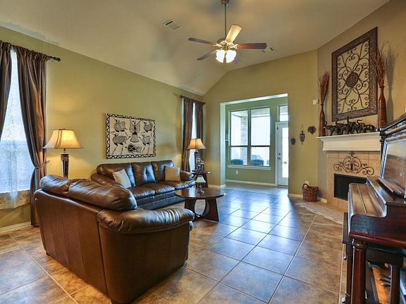 The spacious family room includes a fireplace and views to the back yard.