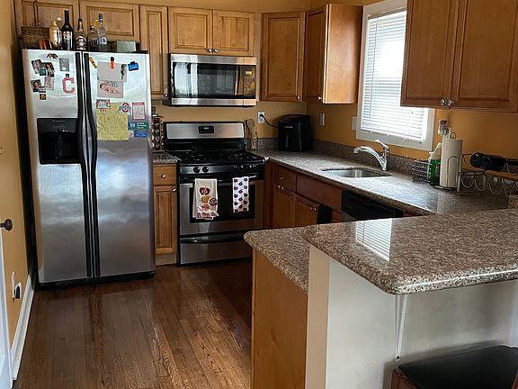 Stainless Steel appliances. Fridge with water and ice dispenser. Microwave, Range, and Dishwasher.