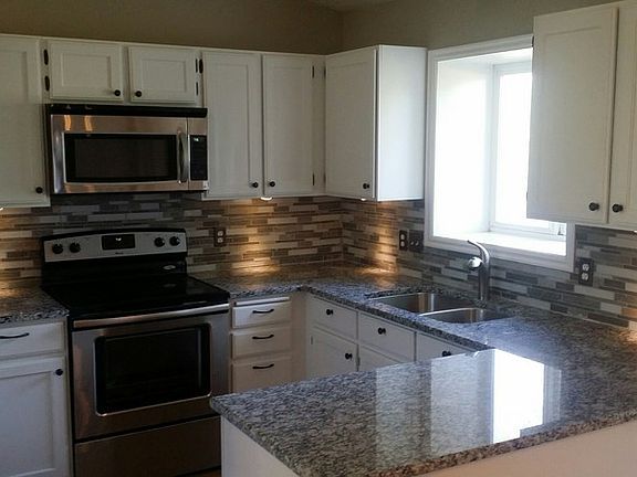 Granite countertop with tile side-splash : Beautiful new Granite counter-top and Brand New Stainless