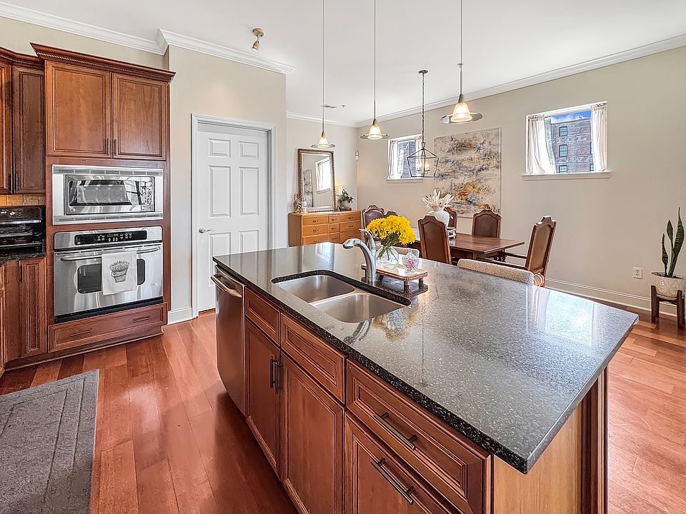 Large island, granite countertops, and stainless steel appliances