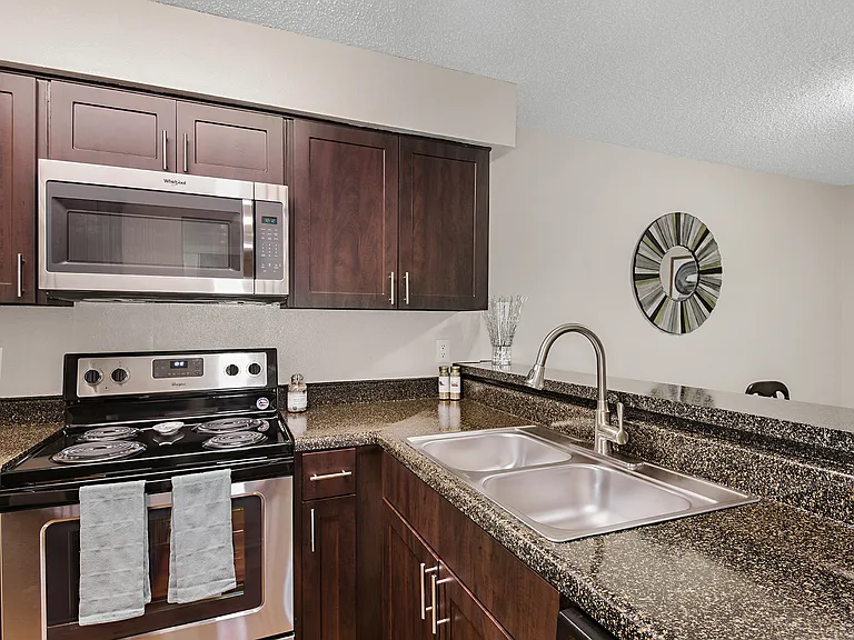 Open Kitchen with Bar Area and Stainless Appliances