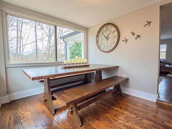Sunroom dining room with windows surrounding to enjoy your private natural wonderland