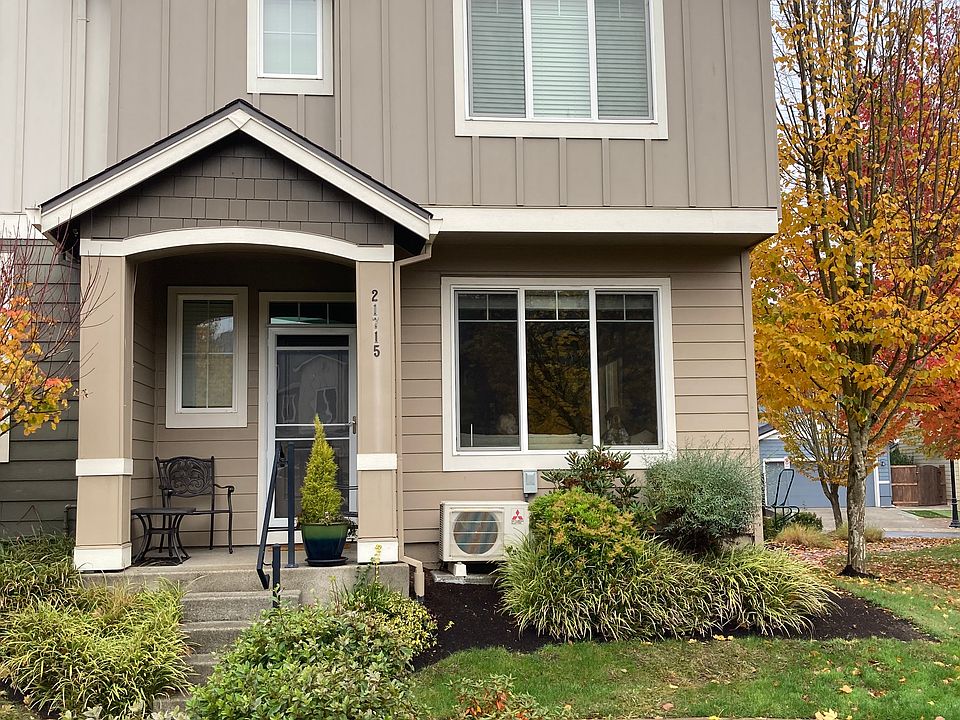 Front, porch, screen door, landscaped.