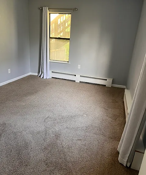 Unfurnished first-floor bedroom with flexible layout potential.
