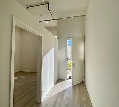 Entry looking left into Bedroom - 12ft tall ceilings with all new lighting with dimmers throughout