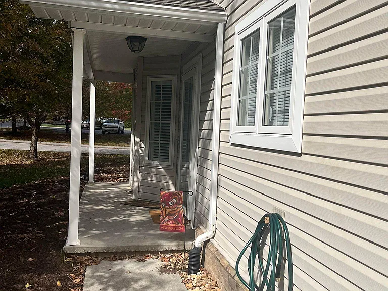 Front door area faces private, quiet wooded area
