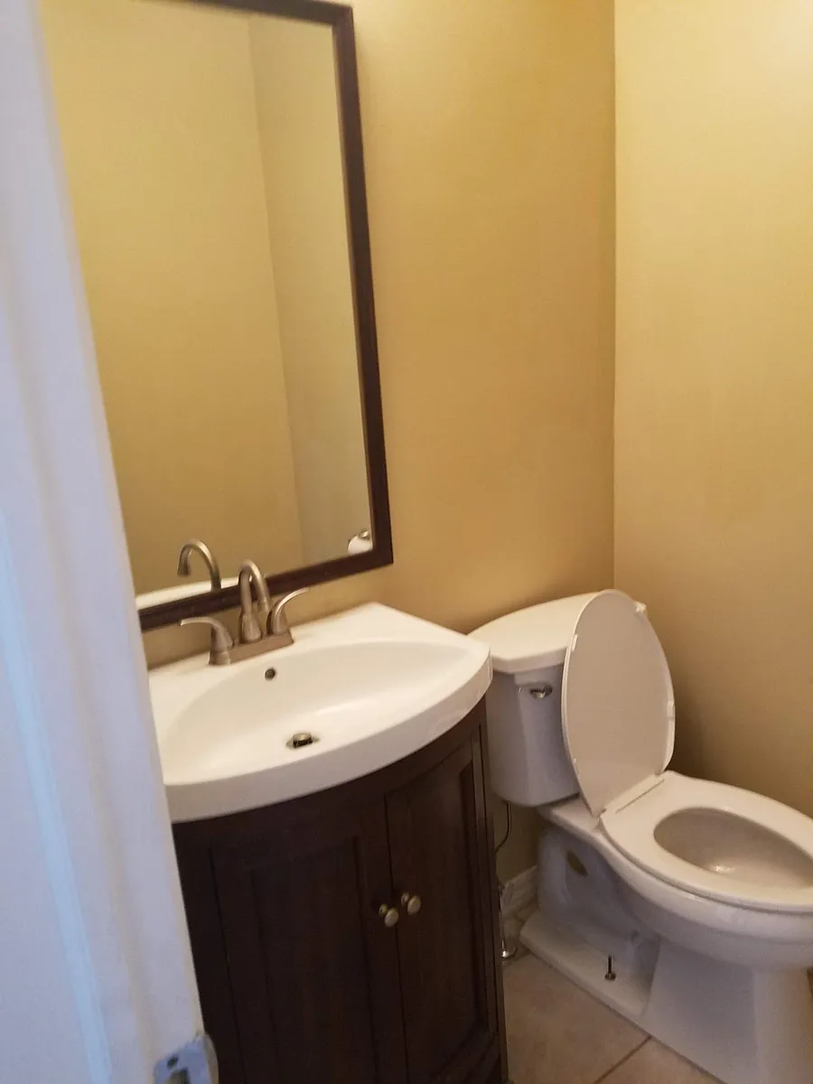 Main floor powder room. - 1601 Coventry Pointe Ln
