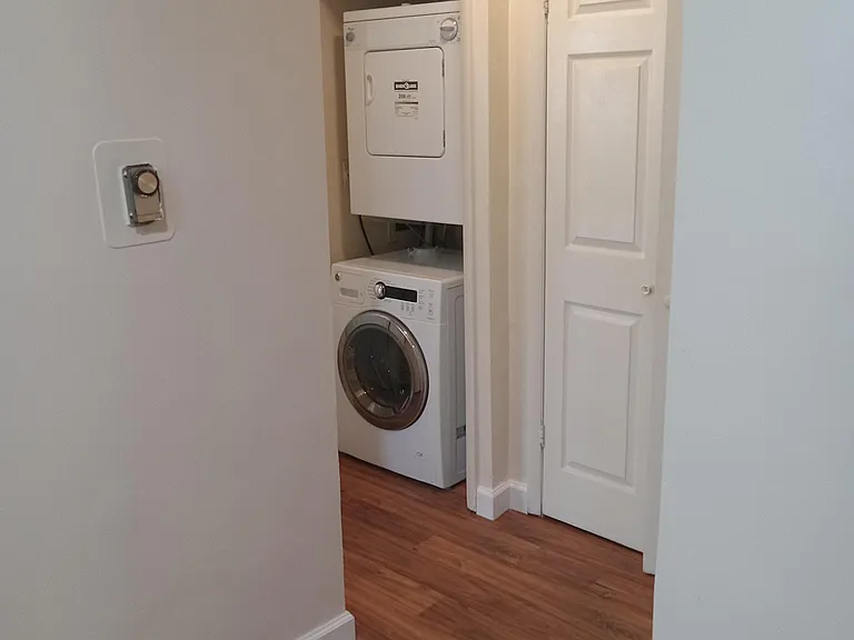 Looking into the hall - in unit washer and dryer