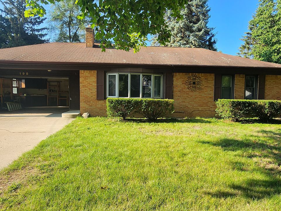 Front of house with nice wide driveway.