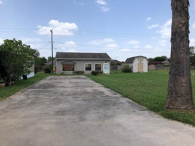 Large storage shed and private fenced patio between house and storage shed. Lon driveway. Very quiet neighborhood. 55+ Community
