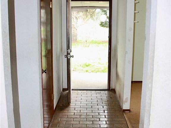 Entrance way with tiled floor.
