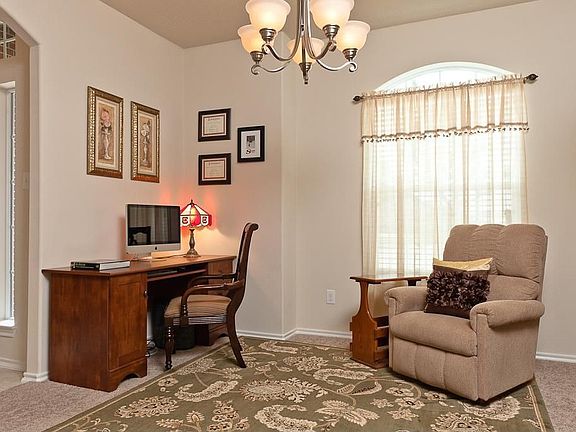 Dining room can be used as a study. Curtains stay with the home.