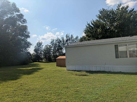 Side of house with shed