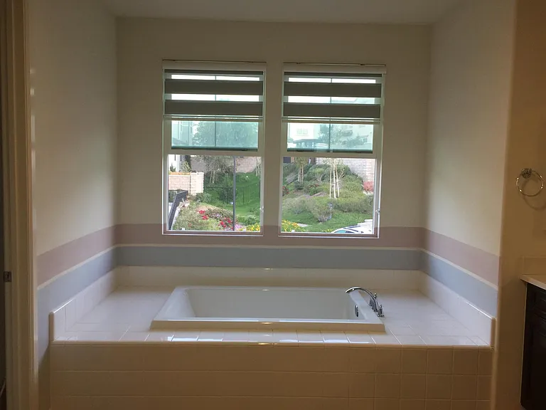 Large bathroom has courtyard view